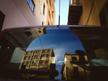 Low angle view of buildings in city against sky