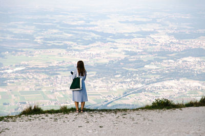 Rear view of woman looking at landscape