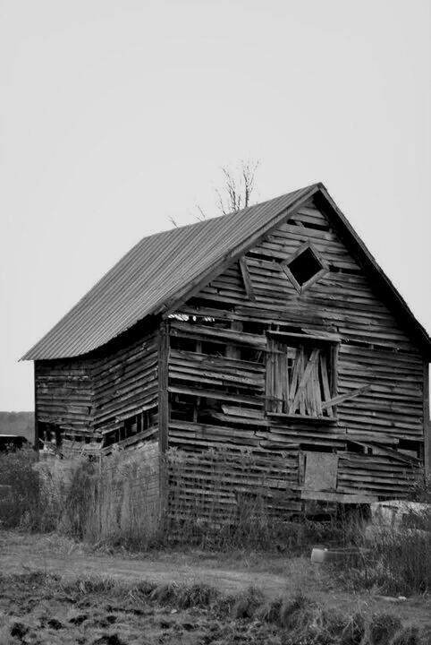 built structure, architecture, clear sky, abandoned, building exterior, field, no people, outdoors, sky, day, barn, grass, rural scene