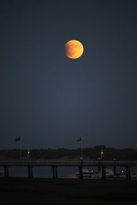Scenic view of moon against sky at night