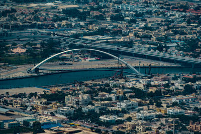 High angle view of bridge and buildings in city