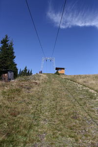 Windmill on field against sky