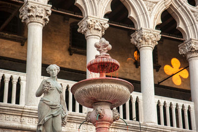 Low angle view of wine fountain in venice carnival