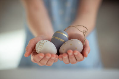 Cropped hand of woman holding pills