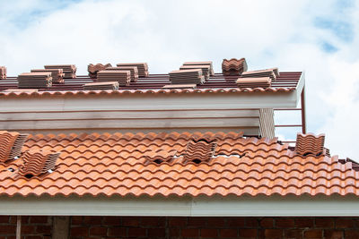 Low angle view of houses against sky