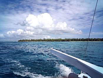 Scenic view of calm sea against cloudy sky