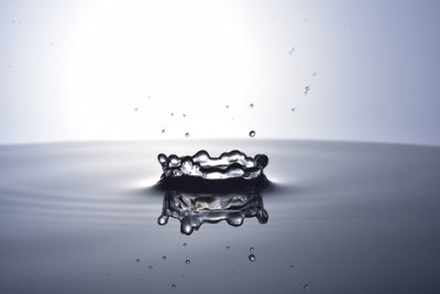 Close-up of splashing water against white background
