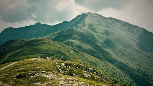 Scenic view of mountains against cloudy sky