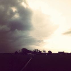 Clouds over landscape at sunset