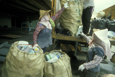 People working at market stall