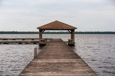 Pier over sea against sky