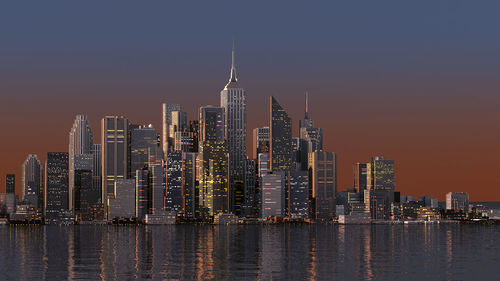 Illuminated buildings in city against sky