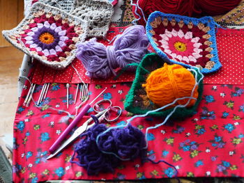 Close-up of knitting equipment on table