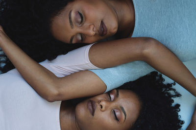 Close up two african woman next to each other portrait