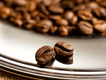 Close-up of coffee beans on table