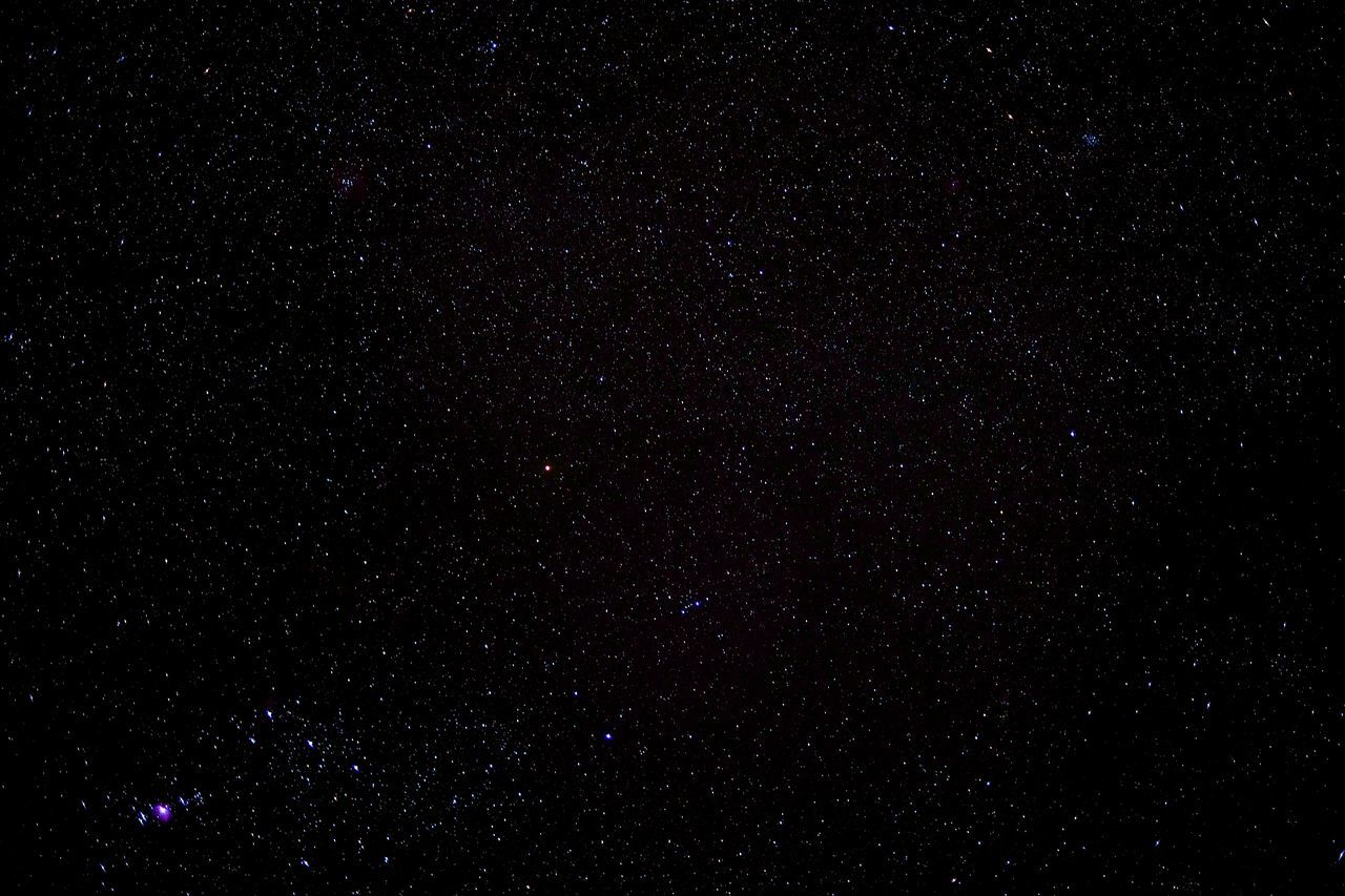 LOW ANGLE VIEW OF STAR FIELD AGAINST SKY AT NIGHT