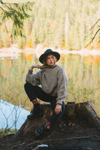 Portrait of man sitting in forest