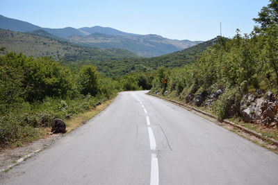 Empty country road along landscape