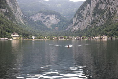 Scenic view of lake and mountains against sky