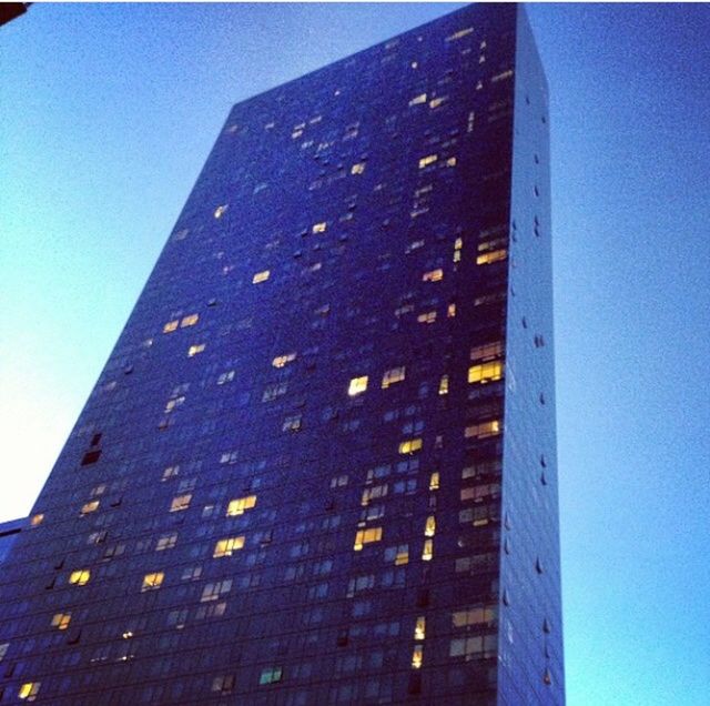 LOW ANGLE VIEW OF BUILDING AGAINST BLUE SKY