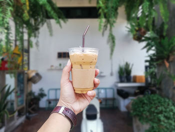 Close-up of hand holding drink