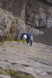 Rear view of people on rock