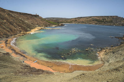 High angle view of scenic sea by mountain