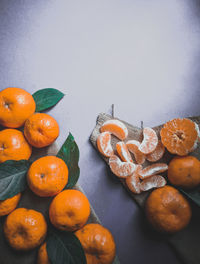 High angle view of orange fruits on table