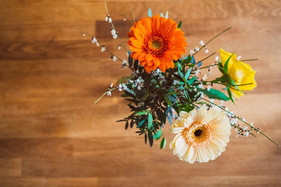 High angle view of daisy flower on table