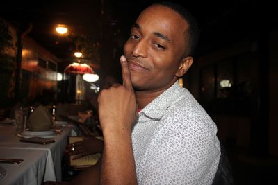 Close-up portrait of smiling man at restaurant