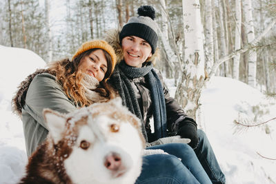 Portrait of smiling woman in snow