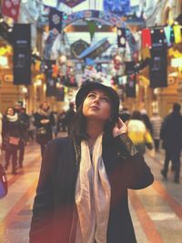 Young woman looking at city street