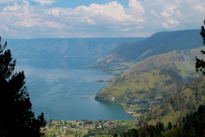 Scenic view of landscape and lake against sky