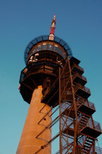 Low angle view of building against clear blue sky