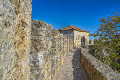 View of historical building against blue sky. castle, lisbon, portugal 