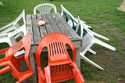 High angle view of deck chairs on field