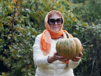 Woman holding pumpkin