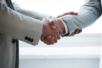 Close-up of business colleagues shaking hands