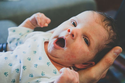 Portrait of cute baby girl on bed