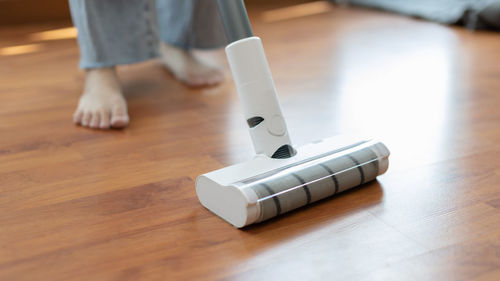 Low section of person with usb on hardwood floor