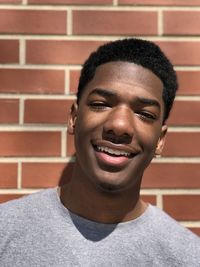 Close-up of young man against wall