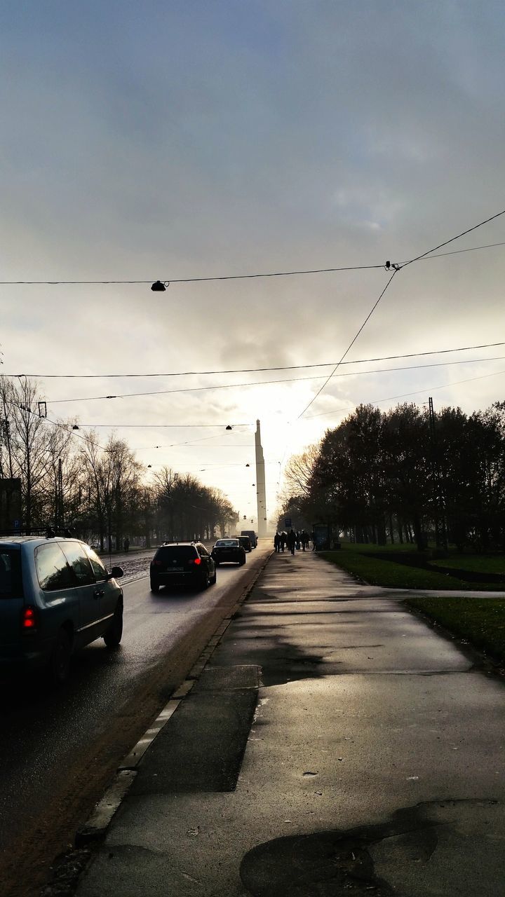 CARS ON ROAD IN CITY