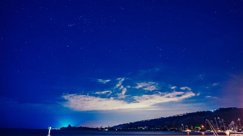 Scenic view of sea against sky at night