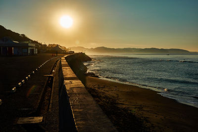 Scenic view of sea against sky during sunrise