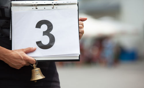 Cropped hand showing number 3