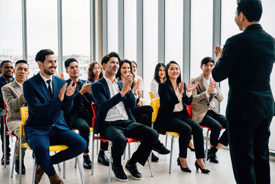 Business colleagues stacking hands