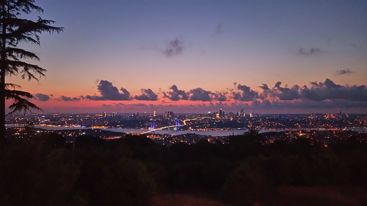 ILLUMINATED CITYSCAPE AT NIGHT