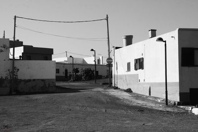 Street amidst buildings against sky