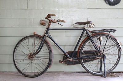 Bicycle leaning on wall