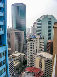 Modern buildings in city against clear sky